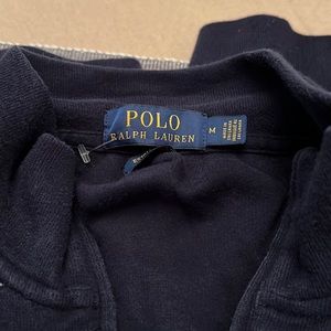 I am selling a polo half zip up jacket it is navy blue women medium